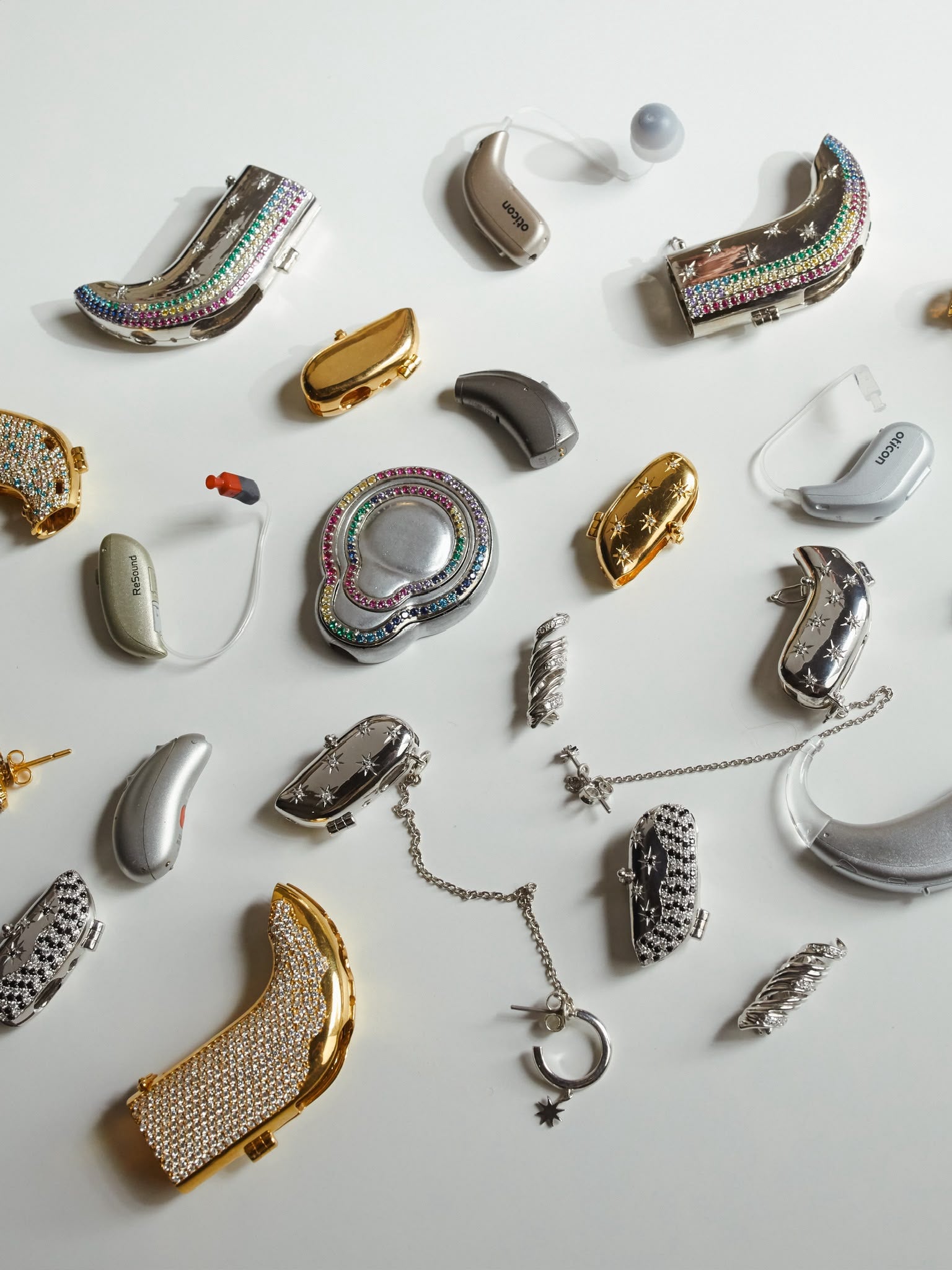 Selection of hearing aids, hearing aid covers and Auzi jewellery