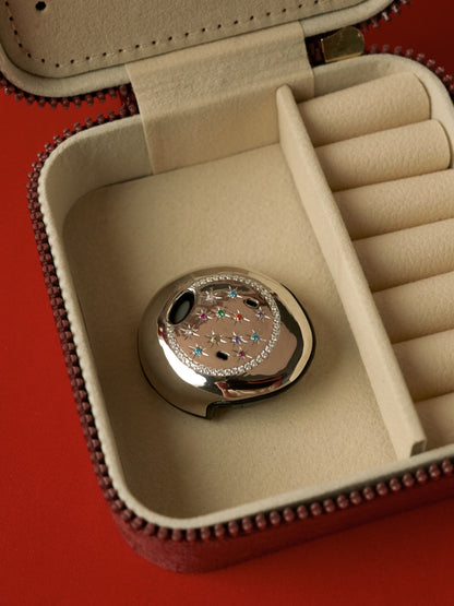 Osia Celeste silver jewellery cover resting on a velvet jewellery box