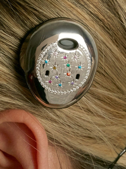 Osia Celeste Osia 2 cover shown worn in the hair above an ear
