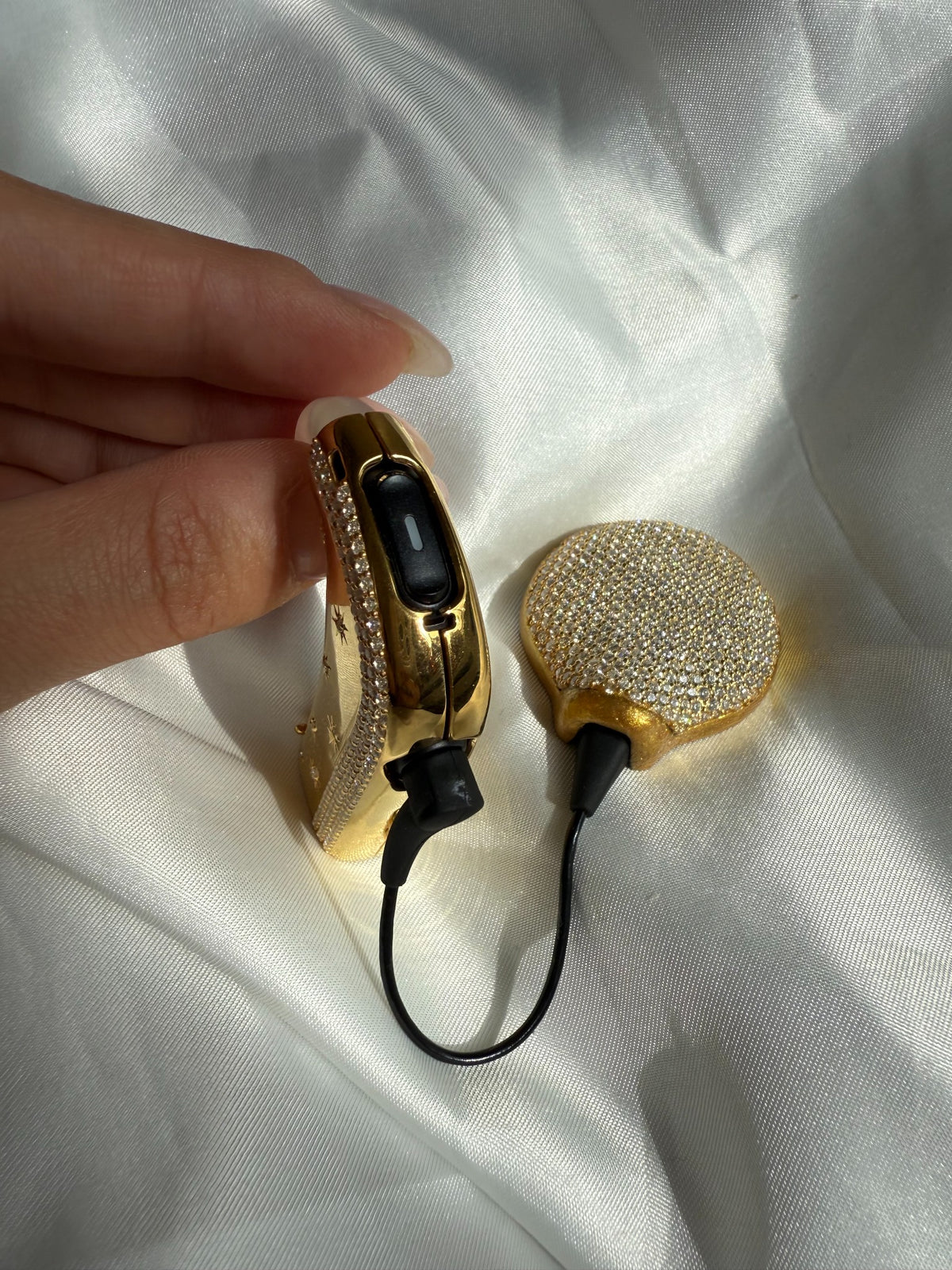 Side view of Shine Bright cochlear processor jewellery showing device controls