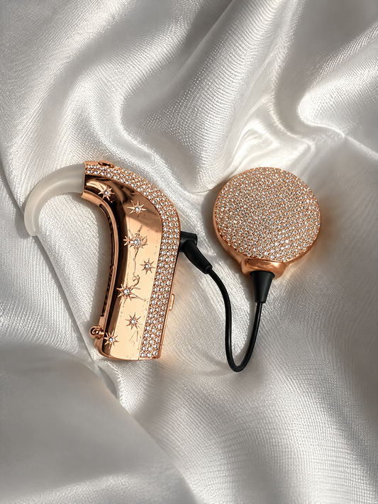 Shine Bright cochlear jewellery in rose gold vermeil with white stones on ivory satin